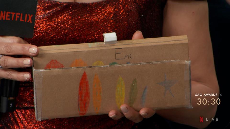 hannah waddingham takes her epic cardboard clutch made by her 9 year old daughter to the sag awards