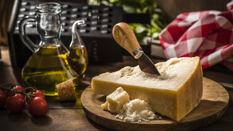 knife stuck in parmesan cheese