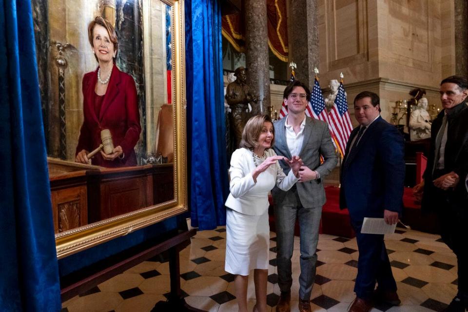 Speaker of the House Nancy Pelosi, D-Calif., is joined by her family as they attend her portrait unveiling ceremony in Statuary Hall at the Capitol in Washington, Wednesday, Dec. 14, 2022.