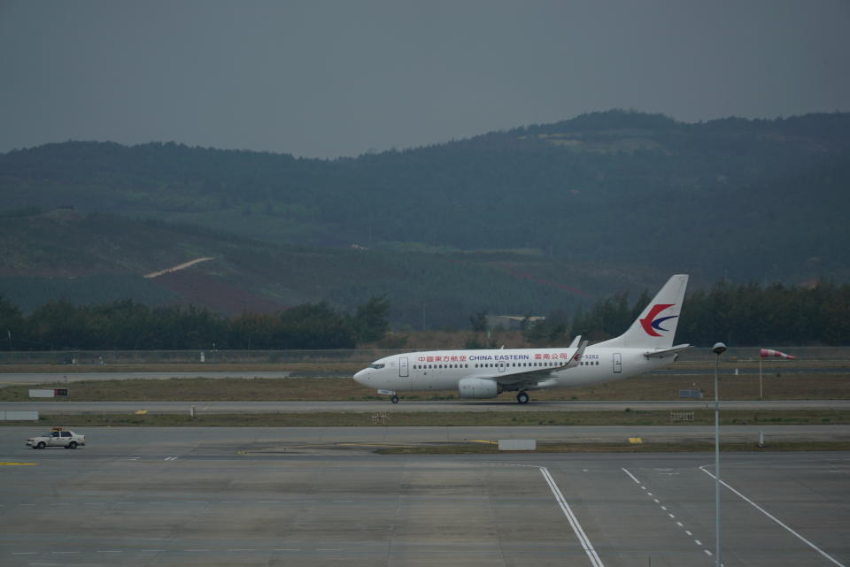 A China Eastern Airlines plane taxis on a runway at Kunming Changshui International Airport, Tuesday, March 22, 2022, in Kunming, in southwest China’s Yunnan province. No survivors have been found among the 132 people onboard a China Eastern Boeing 737-800 that departed from Kunming and crashed Monday in the southern province of Guangxi. As family members gathered at the destination and departure airports, what caused the crash remains a mystery. (AP Photo/Dake Kang)