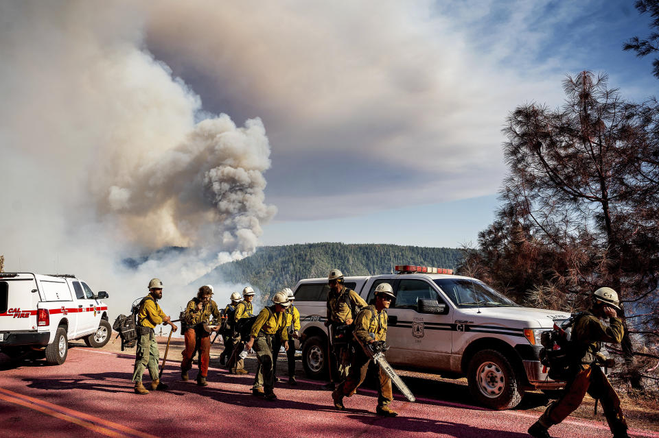 A hand crew prepares to battle the Mosquito Fire along Mosquito Ridge Rd. near the Foresthill community in Placer County, Calif., on Thursday, Sept. 8, 2022. (AP Photo/Noah Berger)