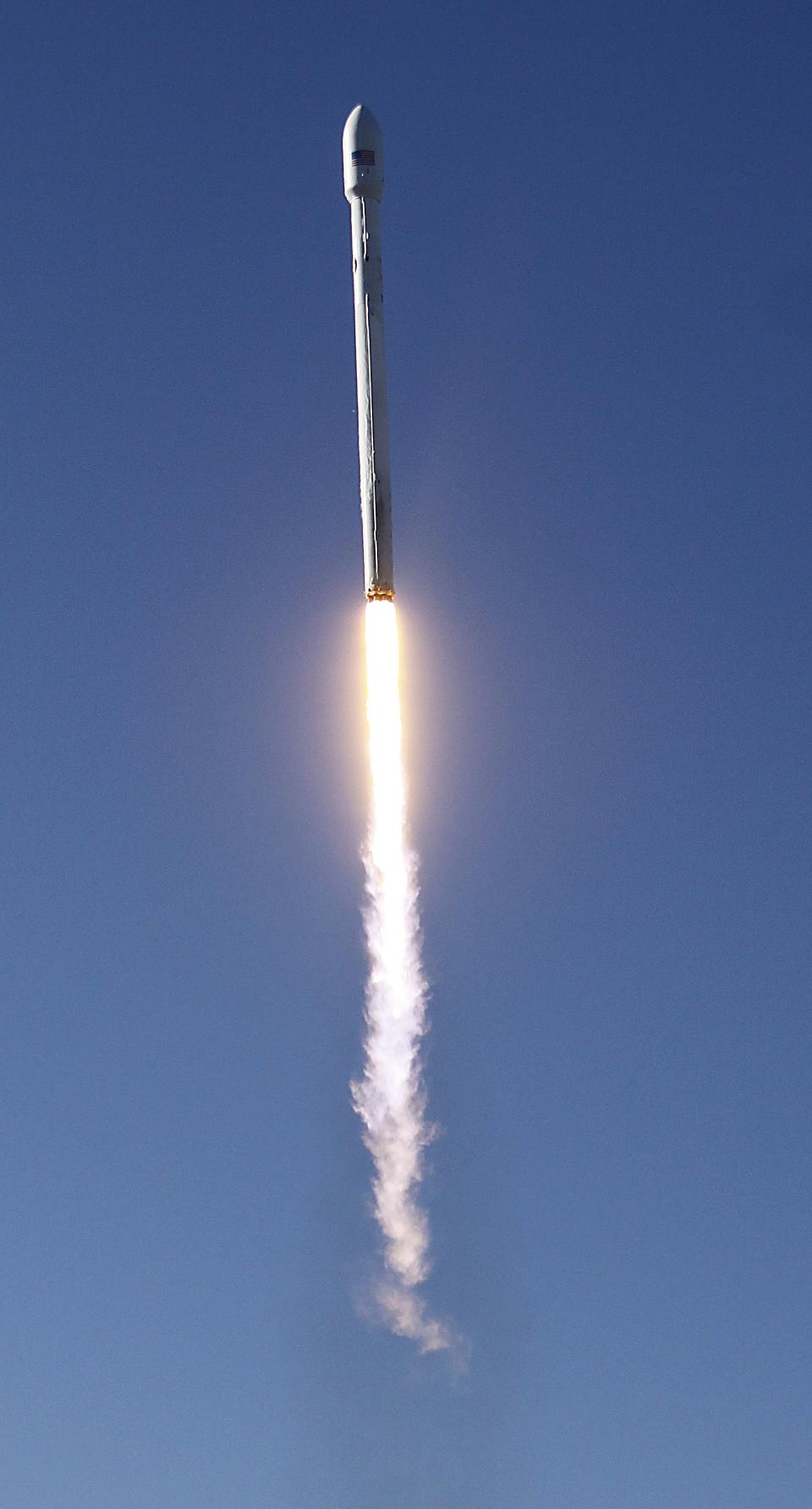 A Falcon 9 rocket carrying a small science satellite for Canada is seen as it is launched from a newly refurbished launch pad in Vandenberg Air Force Station