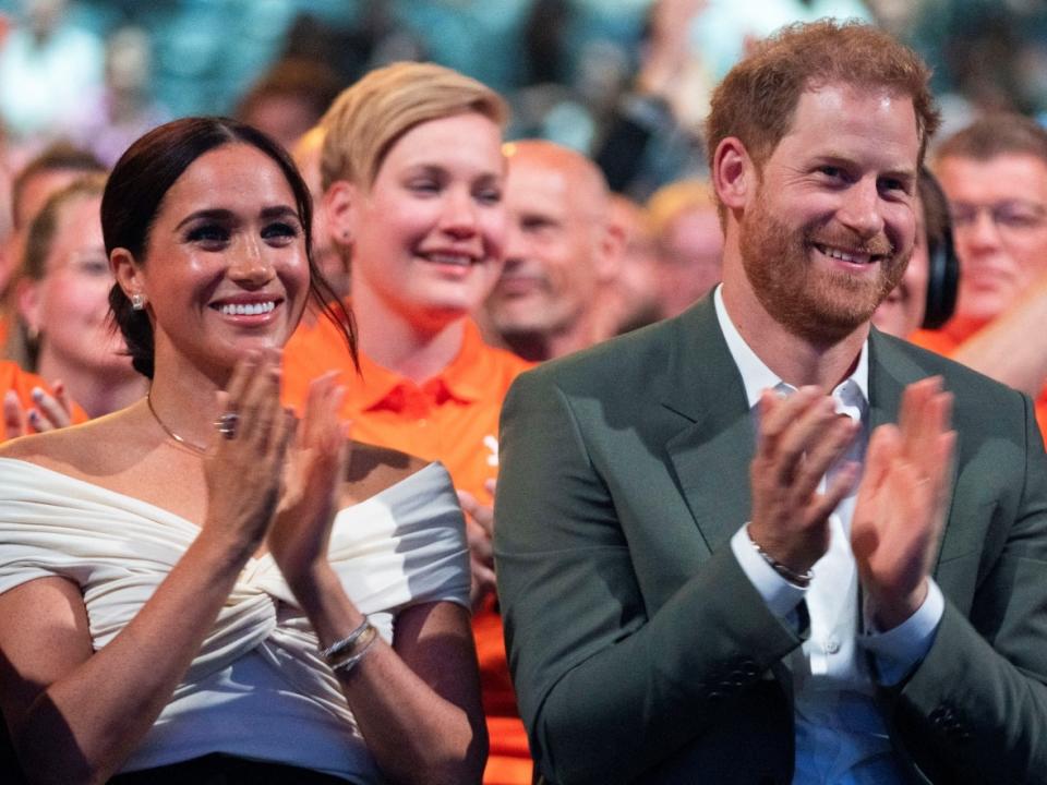 Prince Harry and Meghan Markle attend the opening ceremony of the Invictus Games in The Hague, Netherlands, on April 16. An upcoming docuseries will explore the couple's relationship as part of a multi-year content deal that they signed with Netflix in 2020. (AP Photo/Peter Dejong, Pool - image credit)