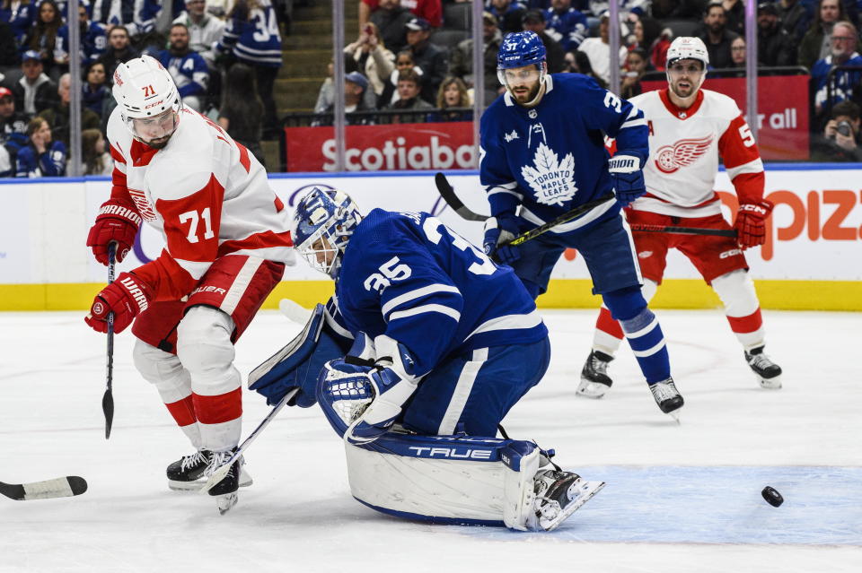 Detroit Red Wings center Dylan Larkin (71) scores against Toronto Maple Leafs goaltender Ilya Samsonov (35) during third-period NHL hockey game action in Toronto, Ontario, Sunday, April 2, 2023. (Christopher Katsarov/The Canadian Press via AP)