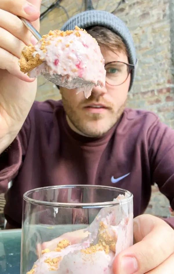 the author holding up a spoonful of cottage cheese ice cream