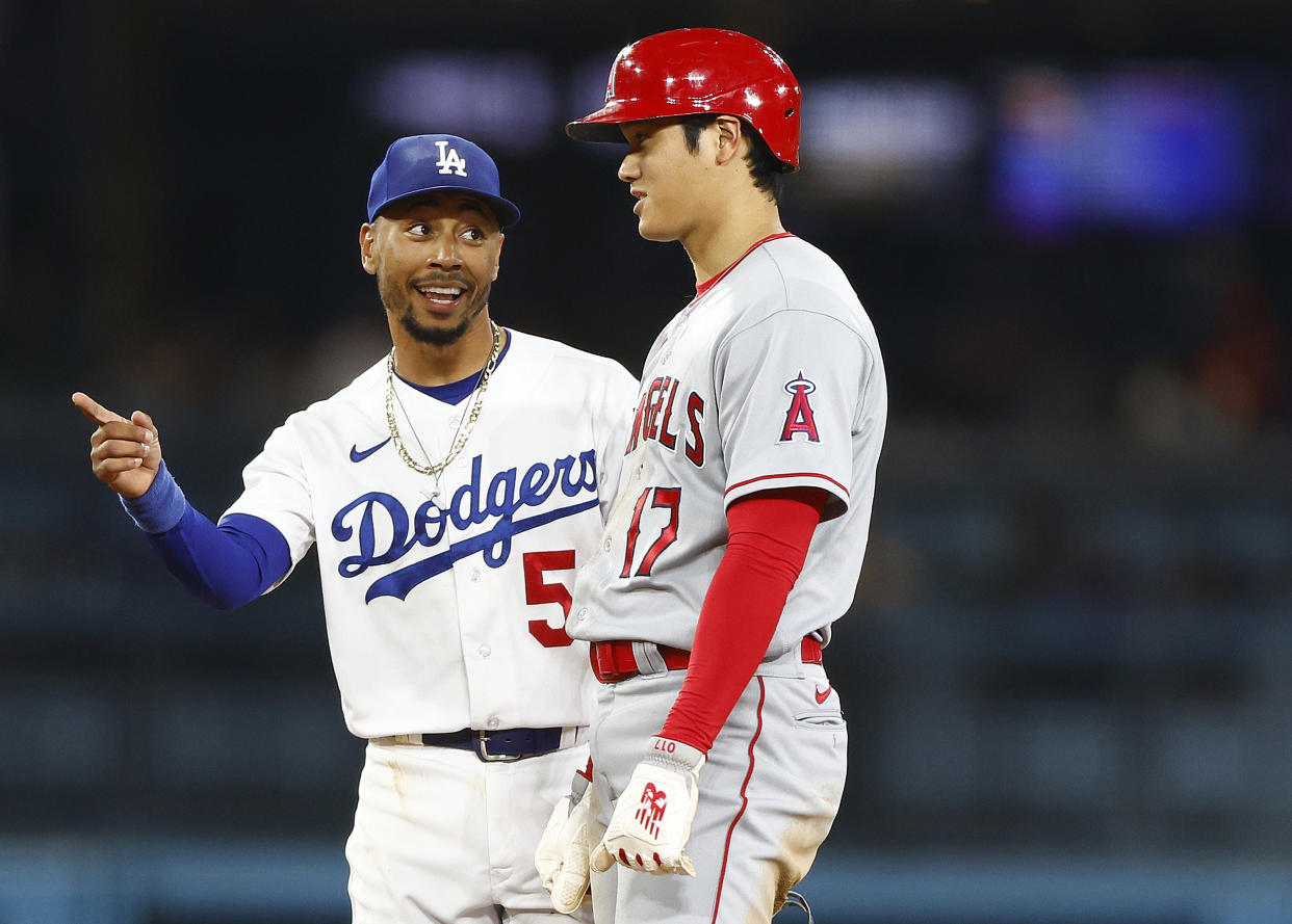 LOS ANGELES, CALIFORNIA - JULY 07:  Mookie Betts #50 of the Los Angeles Dodgers and Shohei Ohtani #17 of the Los Angeles Angels in the fourth inning at Dodger Stadium on July 07, 2023 in Los Angeles, California. (Photo by Ronald Martinez/Getty Images)