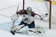 Colorado Avalanche goaltender Philipp Grubauer catches the puck on a shot by the San Jose Sharks during the third period of an NHL hockey game in San Jose, Calif., Wednesday, March 3, 2021. (AP Photo/Jeff Chiu)