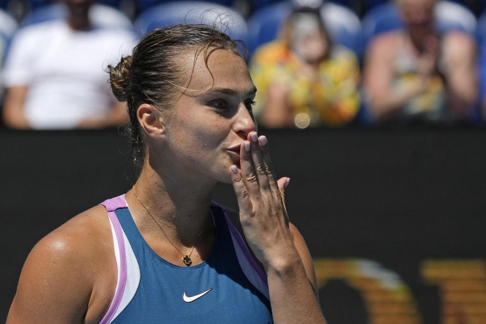 Aryna Sabalenka of Belarus reacts after defeating Donna Vekic of Croatia in their quarterfinal match at the Australian Open tennis championship in Melbourne, Australia, Wednesday, Jan. 25, 2023. (AP Photo/Aaron Favila)