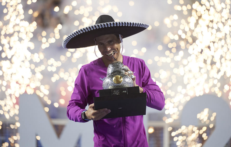 Seen here, Rafael Nadal poses with his Mexican Open title. 