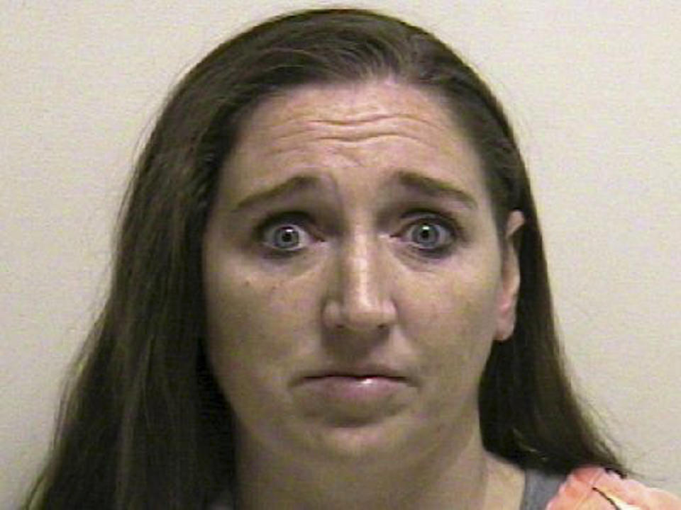 ADVANCE FOR MONDAY APRIL 21 - FILE - This file photo provided by the Utah County jail shows Megan Huntsman, who was booked into the Utah County jail on suspicion of killing six of her newborn children over the past decade. Seven dead babies were found in a garage at a Pleasant Grove home where Huntsman lived up until 2011. Huntsman is scheduled to appear in court April 21, 2014. (AP Photo/Utah County Jail)