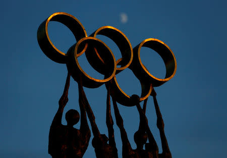 FILE PHOTO: A statue is pictured in front of the International Olympic Committee (IOC) headquarters in Lausanne December 10, 2013. REUTERS/Denis Balibouse/File Photo