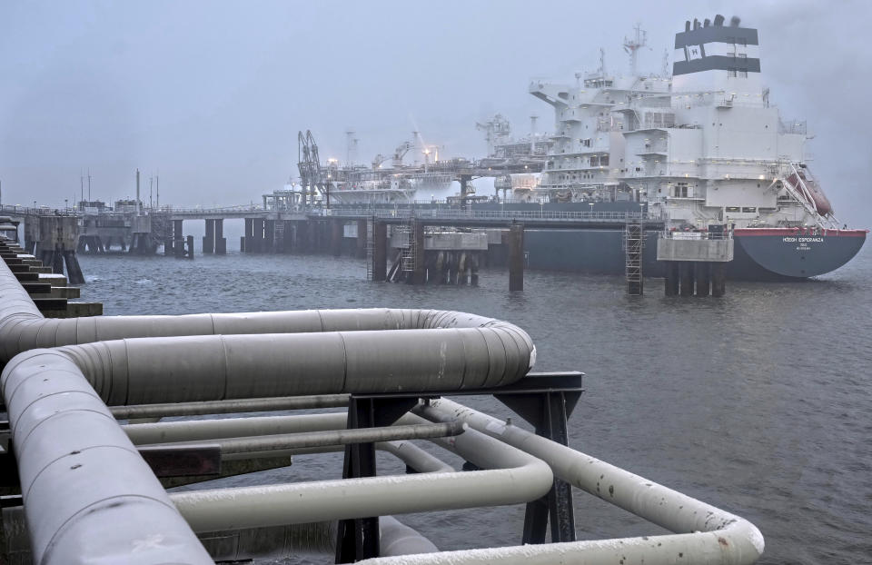 The 'Hoegh Esperanza' Floating Storage and Regasification Unit (FSRU) is anchored during the opening of the LNG (Liquefied Natural Gas) terminal in Wilhelmshaven, Germany, Saturday, Dec. 17, 2022. (AP Photo/Michael Sohn, pool)