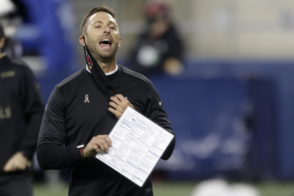 FILE - Arizona Cardinals head coach Kliff Kingsbury removes his mask to yell before an NFL football game against the Seattle Seahawks, Thursday, Nov. 19, 2020, in Seattle. The New England Patriots host the Cardinals on Sunday Nov. 29. With a win, Arizona can also add yet another blow to the New England’s fading playoff hopes. (AP Photo/Lindsey Wasson)