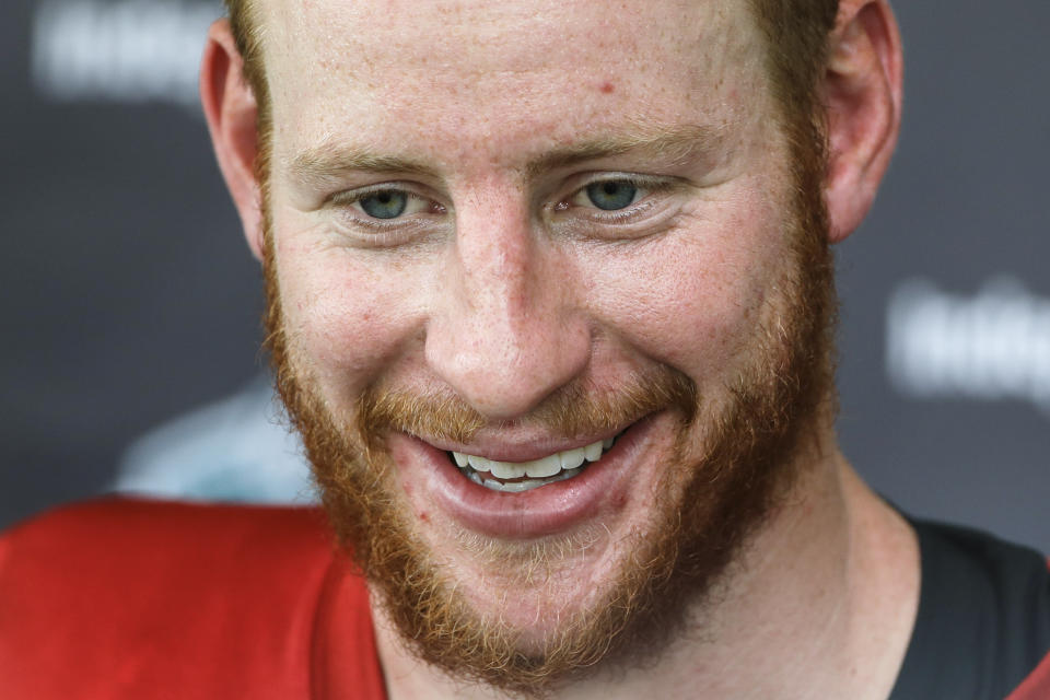 Philadelphia Eagles quarterback Carson Wentz met a young fan at practice on Friday. (AP)