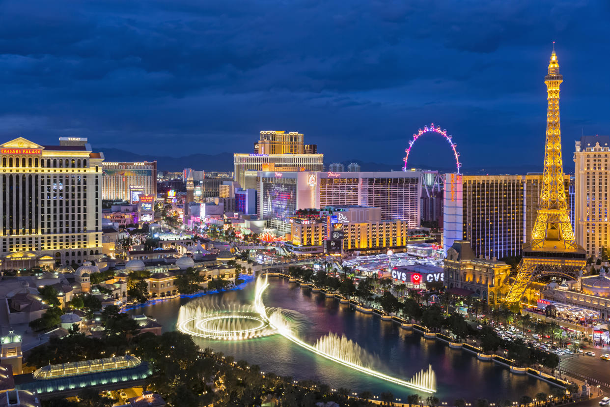 USA, Nevada, Las Vegas, Strip, fountain, hotels and Eiffel Tower at blue hour