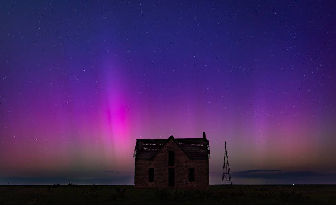 The aurora borealis can be seen in the northern sky near the Marion and Chase County line on Friday night. The abandoned stone limestone house in the pasture was built in 1878.