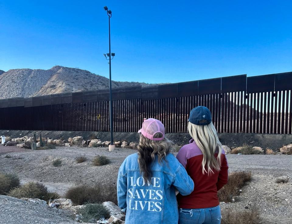 Amy Ford, co-founder of the pro-life nonprofit support group Embrace Grace, left, and Bri Stensrud, Director of Women of Welcome, view the border wall in Ciudad Juarez, Mexico.