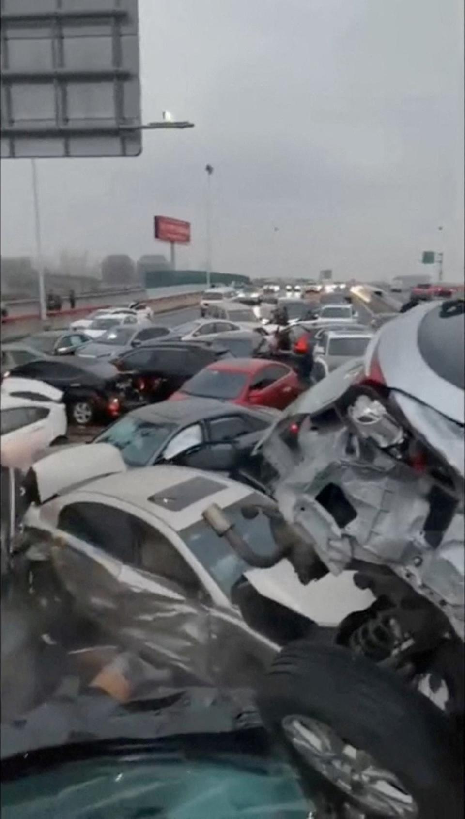 Cars pile up on an overpass during rainy and snowy weather in Suzhou (Reuters)