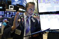 Trader Gregory Rowe works on the floor of the New York Stock Exchange, Wednesday, June 19, 2019. Investors are in wait-and-see mode hours ahead of a widely anticipated Federal Reserve decision on interest rates. (AP Photo/Richard Drew)