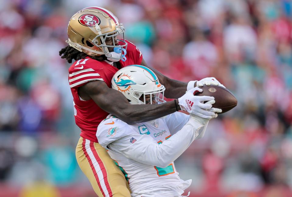 Miami Dolphins cornerback Xavien Howard (25) intercepts a pass intended for San Francisco 49ers wide receiver Brandon Aiyuk.