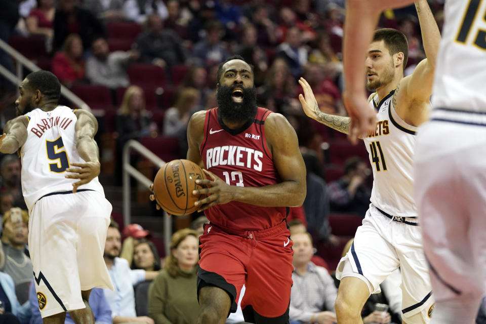 Houston Rockets' James Harden (13) reacts after being fouled by Denver Nuggets' Will Barton (5) during the second half of an NBA basketball game Wednesday, Jan. 22, 2020, in Houston. The Rockets won 121-105. (AP Photo/David J. Phillip)