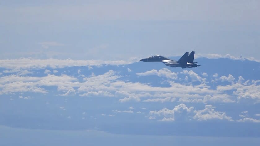 Aa Chinese military plane takes part in a training exercise near Taiwan on Friday.