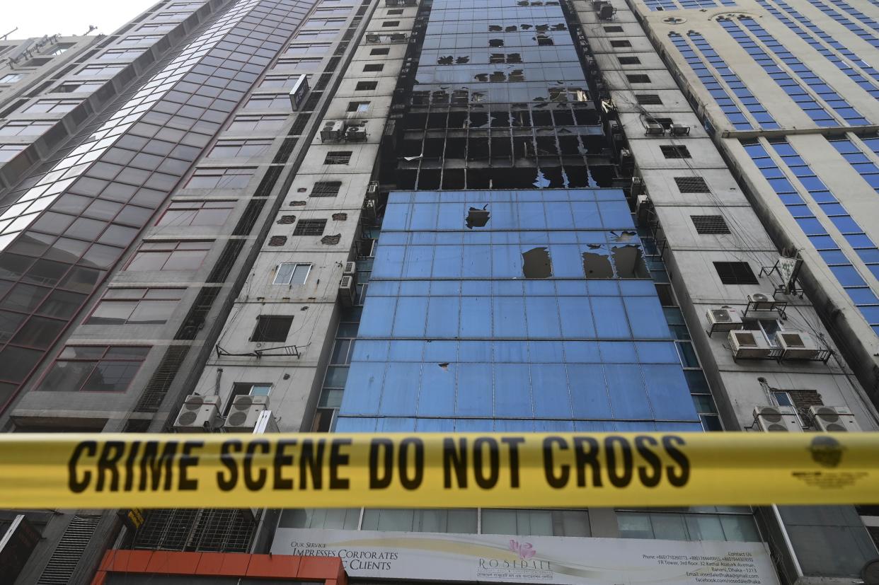 A crime scene ribbon surrounds the burnt building in Dhaka on March 29, 2019, a day after flames tore through the 22-storey FR Tower.  (Photo: Munir Uz Zaman/AFP/Getty Images)