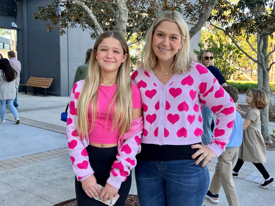 The author and her daughter wearing matching pink cardigans with hearts on them.