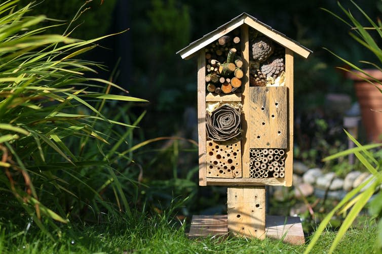 A bee house in a garden.