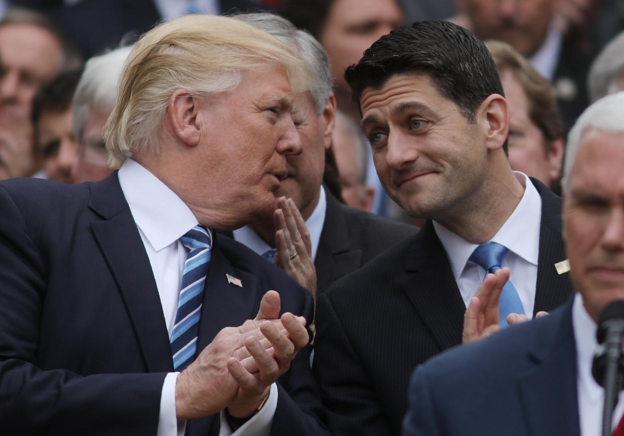 President Donald Trump chats with House Speaker Paul Ryan at a gathering of congressional Republicans in the White House Rose Garden in May. (Photo: Carlos Barria / Reuters)