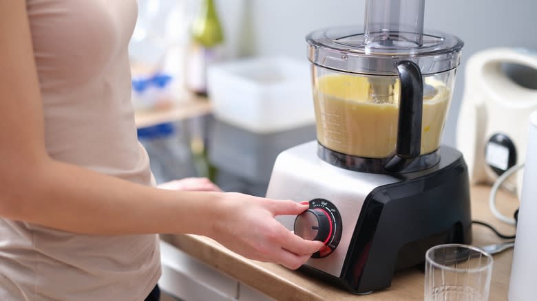 woman using food processor