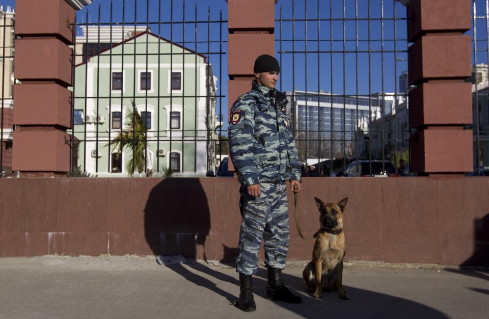 Russian police officer stands on a street in Sochi