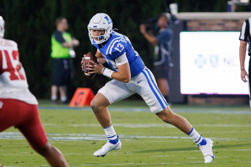 Duke quarterback Riley Leonard (13) carries the ball during the first half of an NCAA college football game against Temple in Durham, N.C., Friday, Sept. 2, 2022. (AP Photo/Ben McKeown)