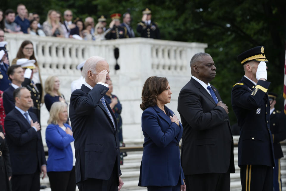 President Joe Biden stands with Vice President Kamala Harris and Defense Secretary Lloyd Austin as the national anthem is played before laying a wreath at The Tomb of the Unknown Soldier at Arlington National Cemetery in Arlington, Va., on Memorial Day, Monday, May 29, 2023. (AP Photo/Susan Walsh)