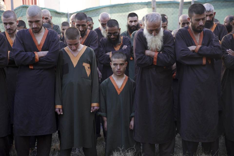 Islamic State militants either arrested or surrounded up to the Afghan government are presented to media in Kabul, Afghanistan, Saturday, Dec. 21, 2019. The country's intelligence service says Saturday that there are more than 75 women and 159 children most of them form foreign countries in the custody of the agency known as the National Deteriorate for Security. (AP Photo/Rahmat Gul)