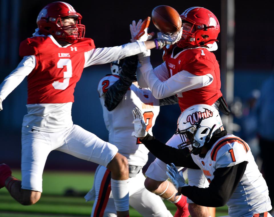 Albany safety London Fuentes runs in to block a pass meant for Wink wide receiver Jordan Tally during Saturday's Class 2A Division II regional semifinal in San Angelo. Tally was covered by Albany safety Cason Fairchild, who in turn was covering the Wildcats' Brandon Peters (bottom right). Fuentes had two interceptions in the game.