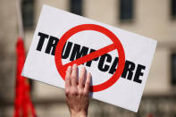 Activists protest against the Republican plan to repeal Obamacare during a rally in Freedom Plaza in Washington March 23, 2017. REUTERS/Kevin Lamarque