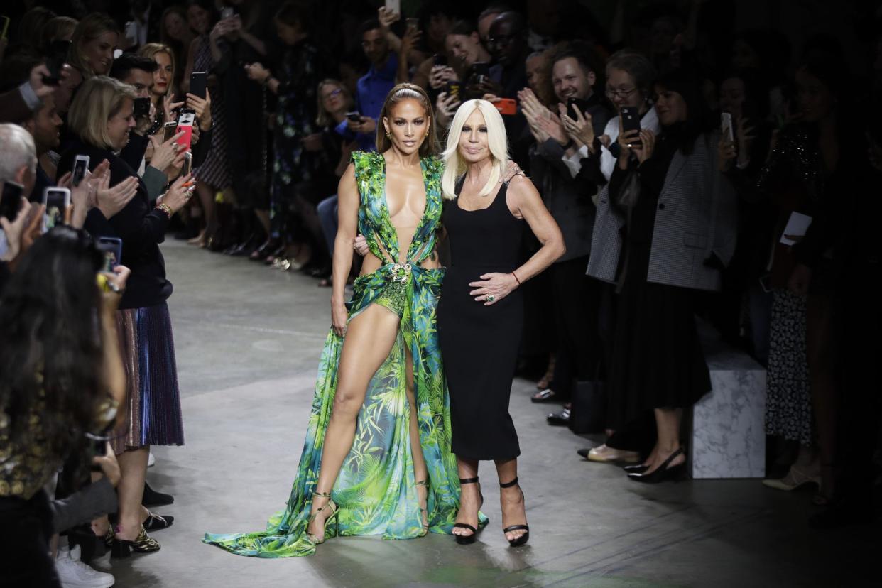 Jennifer Lopez threw things all the way back to 2000 on Sept. 20, 2019 when she closed out the Versace spring/summer 2020 show during Milan Fashion Week in Italy. Lopez, donning a dress strikingly similar to the famed green jungle-print dress she wore to the 2000 Grammy Awards, sashayed out onto the runway, prompting a flurry of photos.