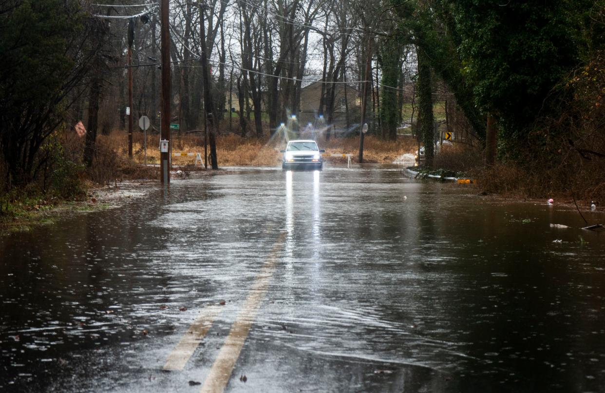 A person drives through standing water on Main St. near Zimmerman Lane due to the most recent rain storm in Hulmeville on Monday, Dec. 18, 2023.

Daniella Heminghaus | Bucks County Courier Times