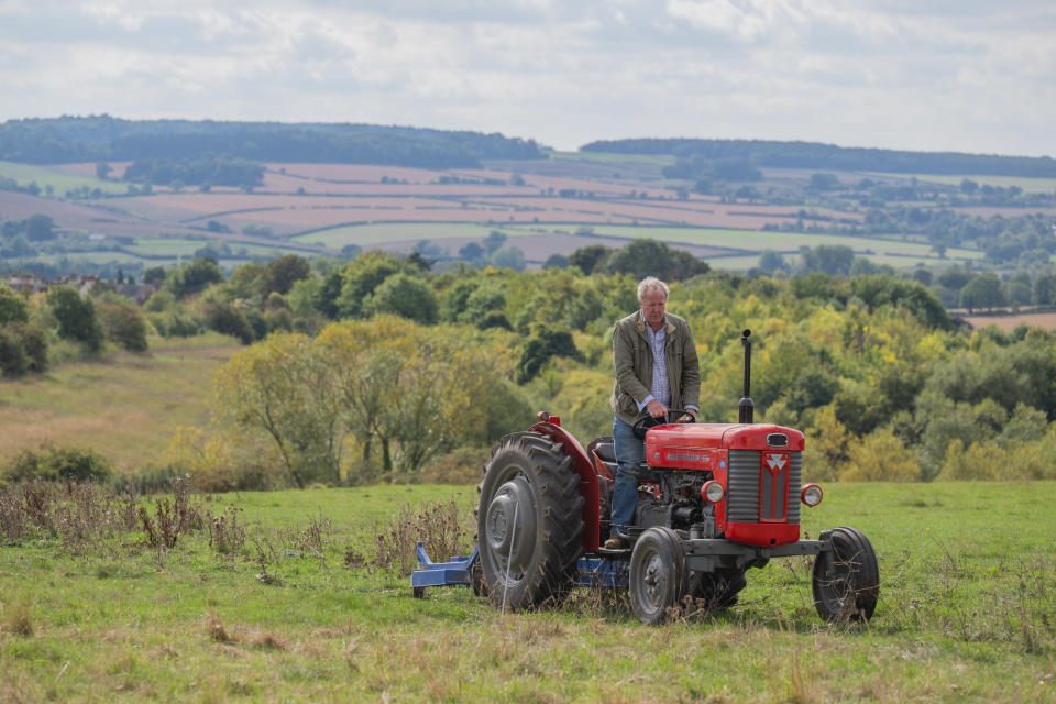 Jeremy Clarkson riding a tractor in Clarkson's Farm