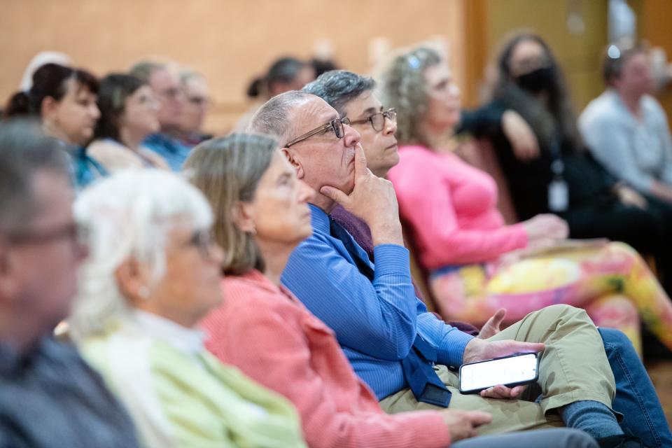 Attendees of a meeting on affordable housing listen to a speaker at Harrah’s Cherokee Center, March 27, 2024.