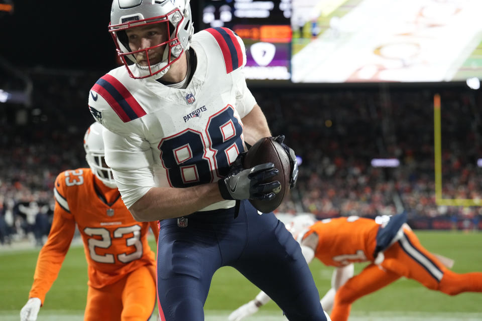 New England Patriots tight end Mike Gesicki catches an 11-yard pass for a touchdown during the second half of an NFL football game against the Denver Broncos, Sunday, Dec. 24, 2023, in Denver. (AP Photo/David Zalubowski)