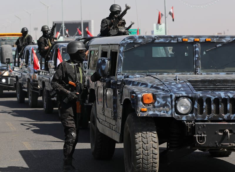 Houthi police forces are pictured on a street in Sanaa