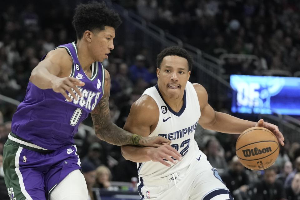 Memphis Grizzlies' Desmond Bane drives past Milwaukee Bucks' MarJon Beauchamp during the second half of an NBA basketball game Friday, April 7, 2023, in Milwaukee. (AP Photo/Morry Gash)