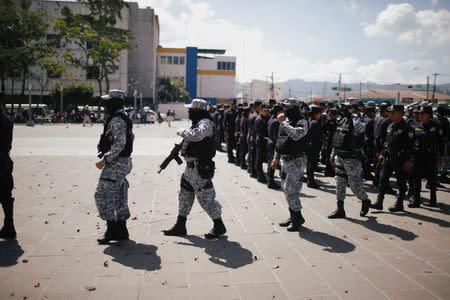Salvadoran police officers prepare to be deployed before the presidential elections in downtown San Salvador, El Salvador February 2, 2019. REUTERS/Jose Cabezas