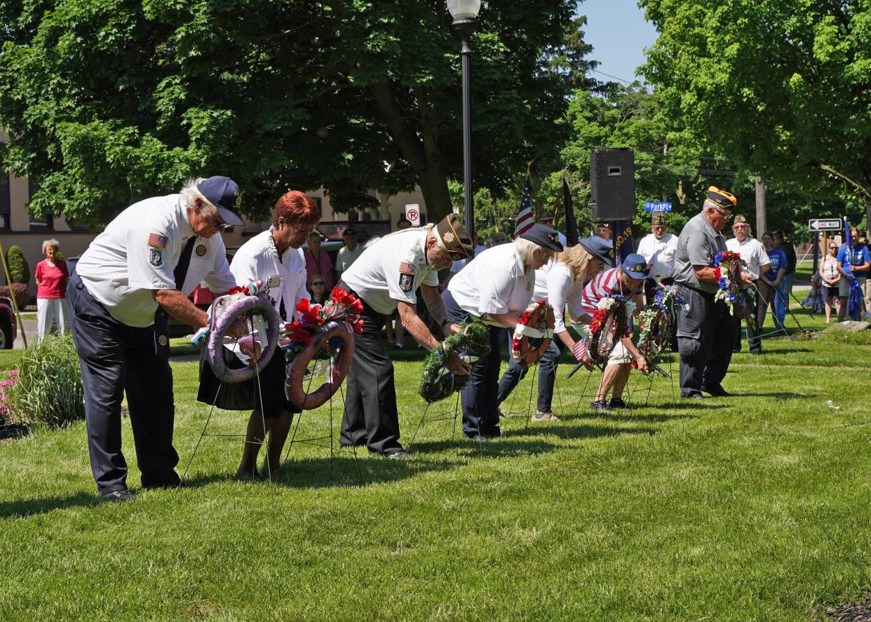 Wreaths are placed during Adrian's 2022 Memorial Day ceremony at Monument Park to honor those who died while serving their country.