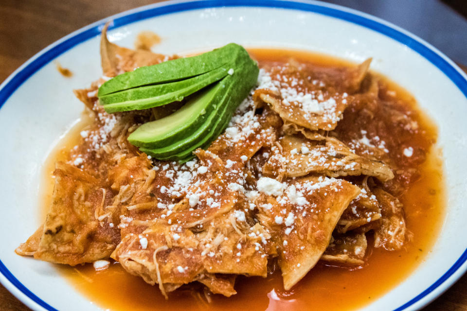 Mexican chilaquiles with avocado.