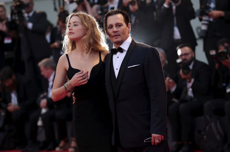 FILE PHOTO: Actor Depp and his wife Heard attend the red carpet event for the movie "Black Mass" at the 72nd Venice Film Festival