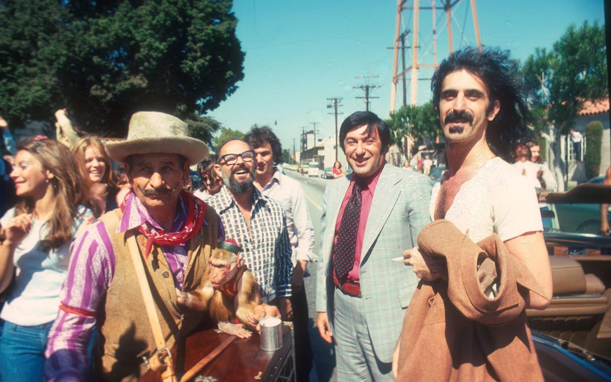 Mo Ostin (centre) with his signing Frank Zappa - WireImage