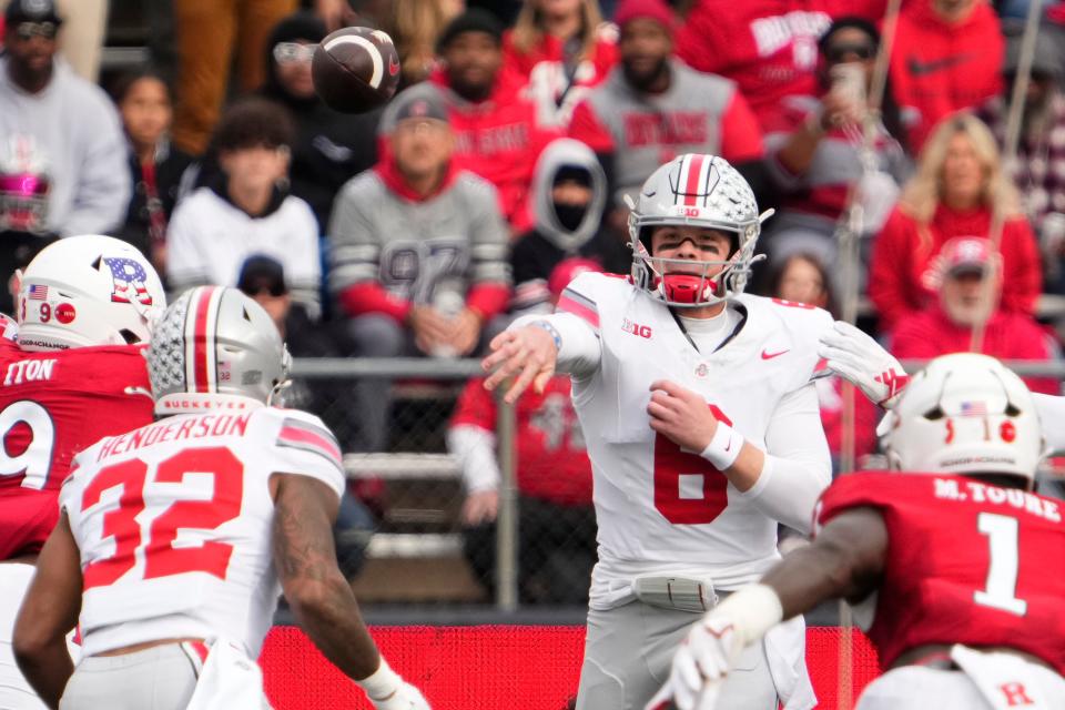 Nov 4, 2023; Piscataway, New Jersey, USA; Ohio State Buckeyes quarterback Kyle McCord (6) throws to running back TreVeyon Henderson (32) during the NCAA football game against the Rutgers Scarlet Knights at SHI Stadium. Ohio State won 35-16.